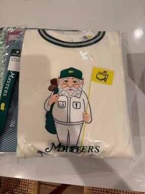 Masters Cream Graphic Caddy Tee with Green Cap and Yellow Flag